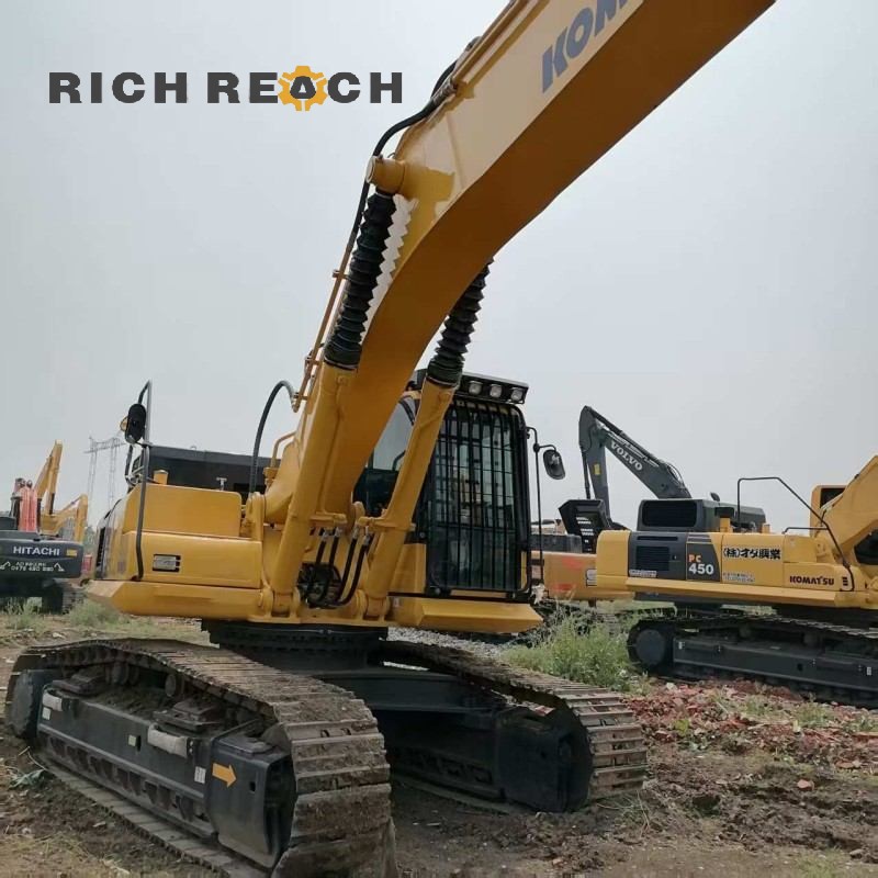 Side profile of a 2018 Komatsu PC450-8 excavator showing boom and arm, $52,778 for sale